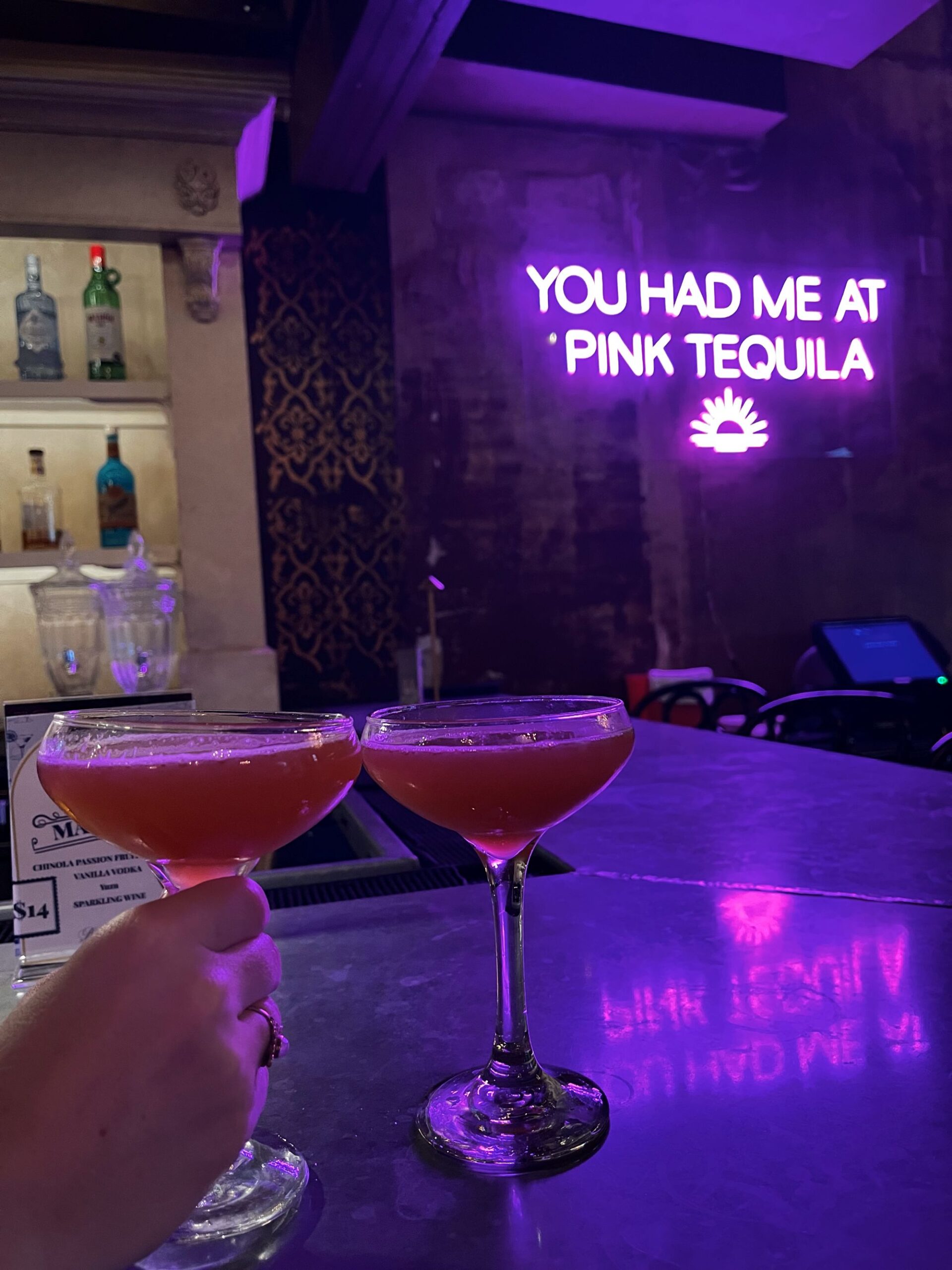 a neon sign that says you had me at pink tequila