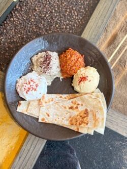 bread and scoops of dips